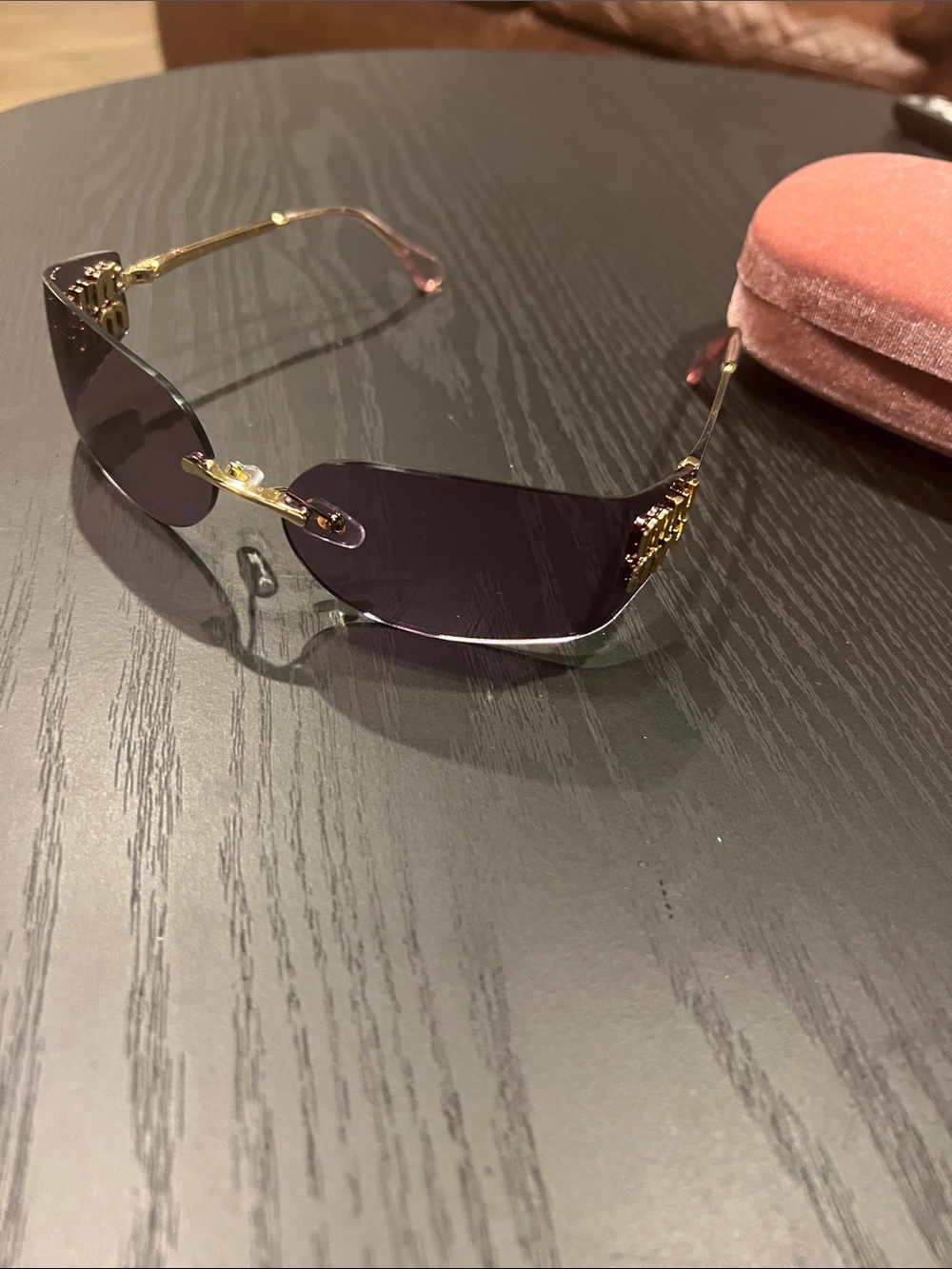 Miu Miu Rimless Sunglasses with Gold Arms and Dark Purple Lenses
